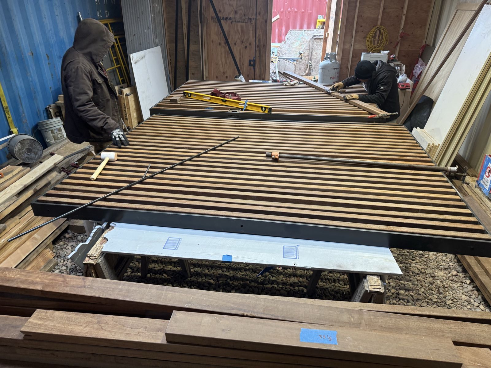 Fabrication shop with material panels on sawhorses