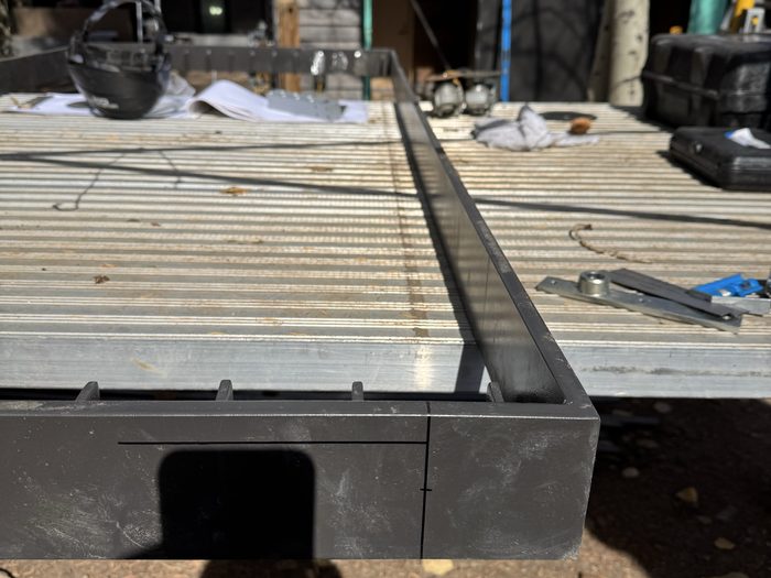 Layout lines marked on the frame corner — the track the slats will seat into.