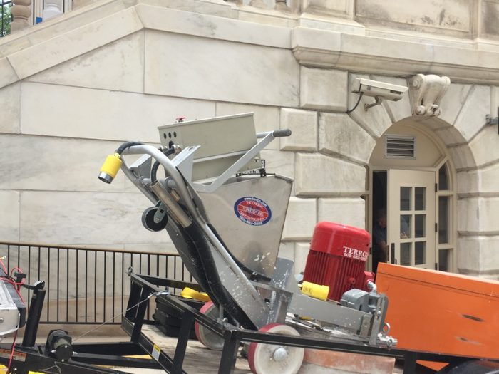 Terrco grinder staged on a trailer outside the Byron White Federal Building.