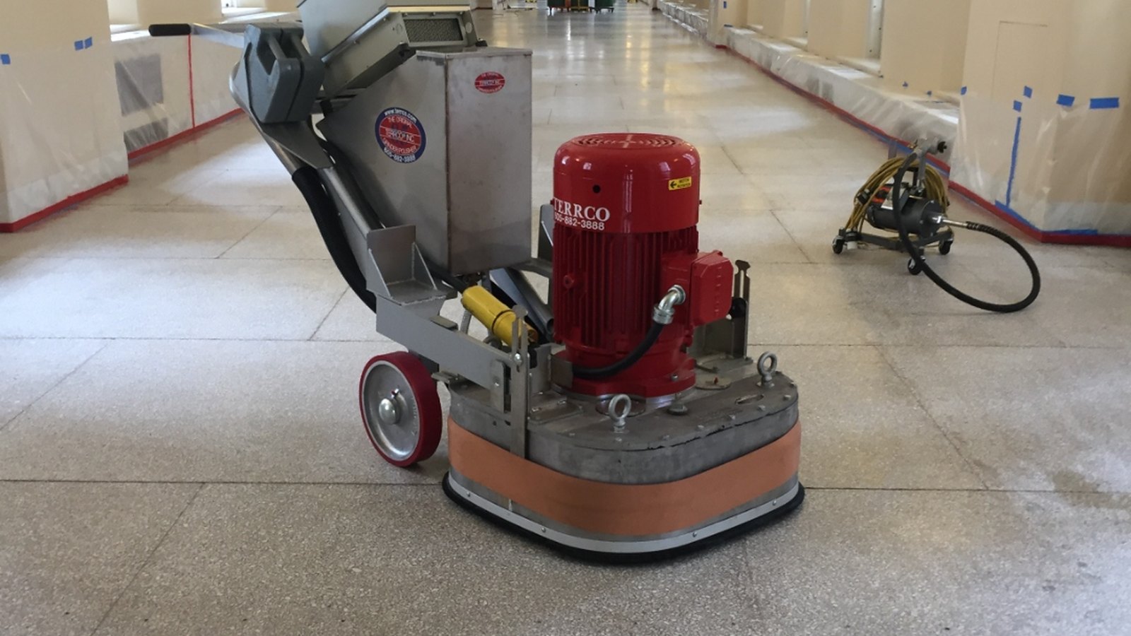 Terrazzo grinder working the corridor floor inside the Byron White Federal Building